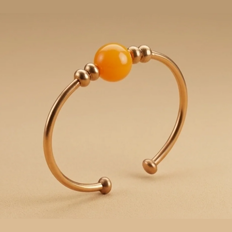 Circle gold-tone cuff with amber bead